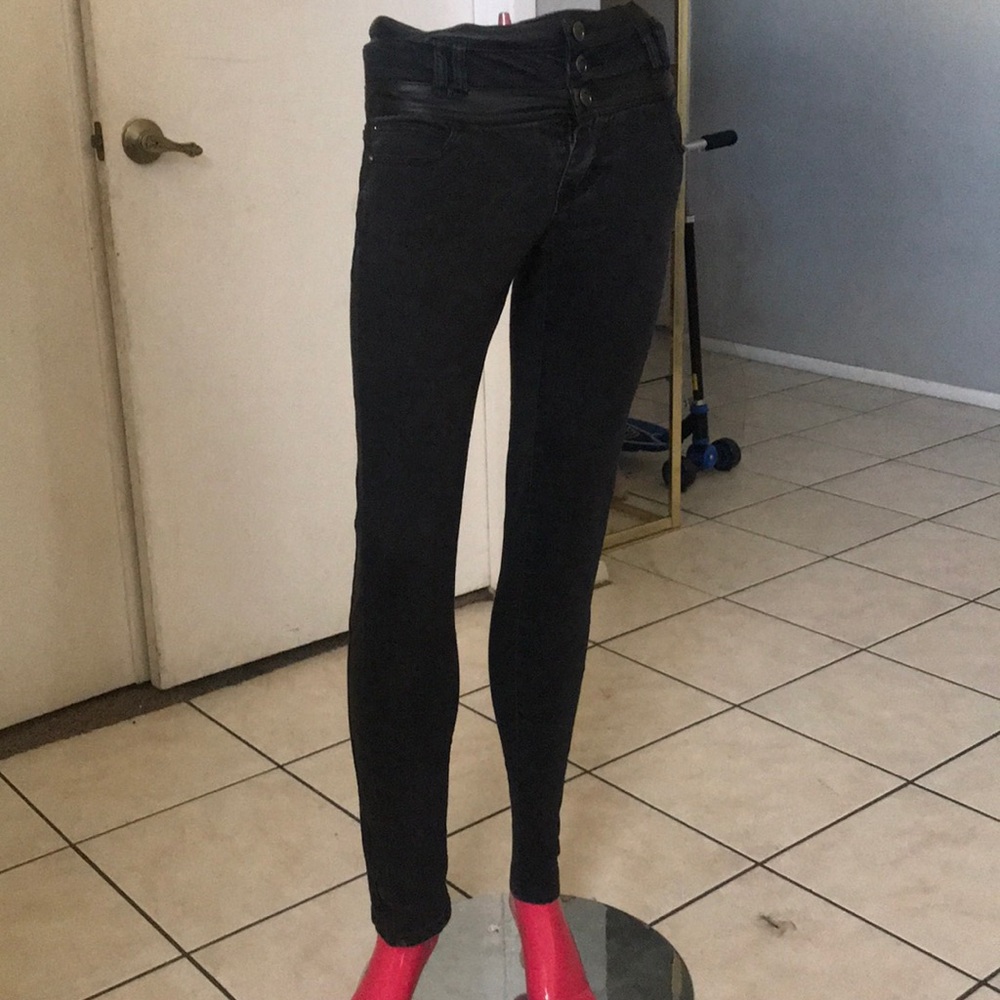 Faded black and leather jeans